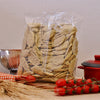 Fresh organic Strascinati with Sage, typical Lucanian artisan pasta